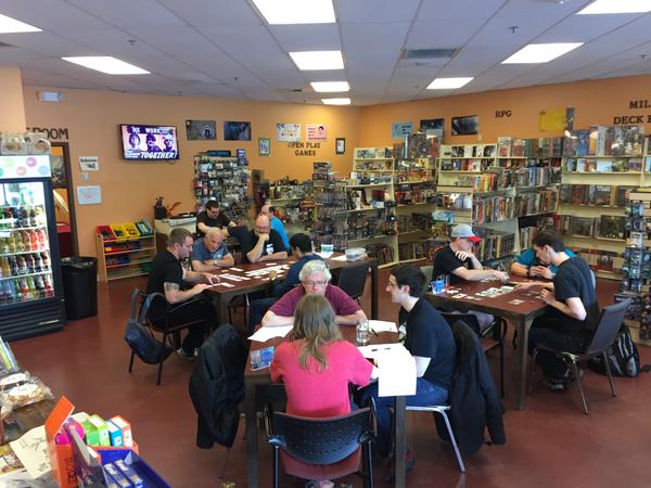 A picture of our store layout from 2015, showing people playing games.